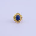 Bague saphir dorée fond lilas