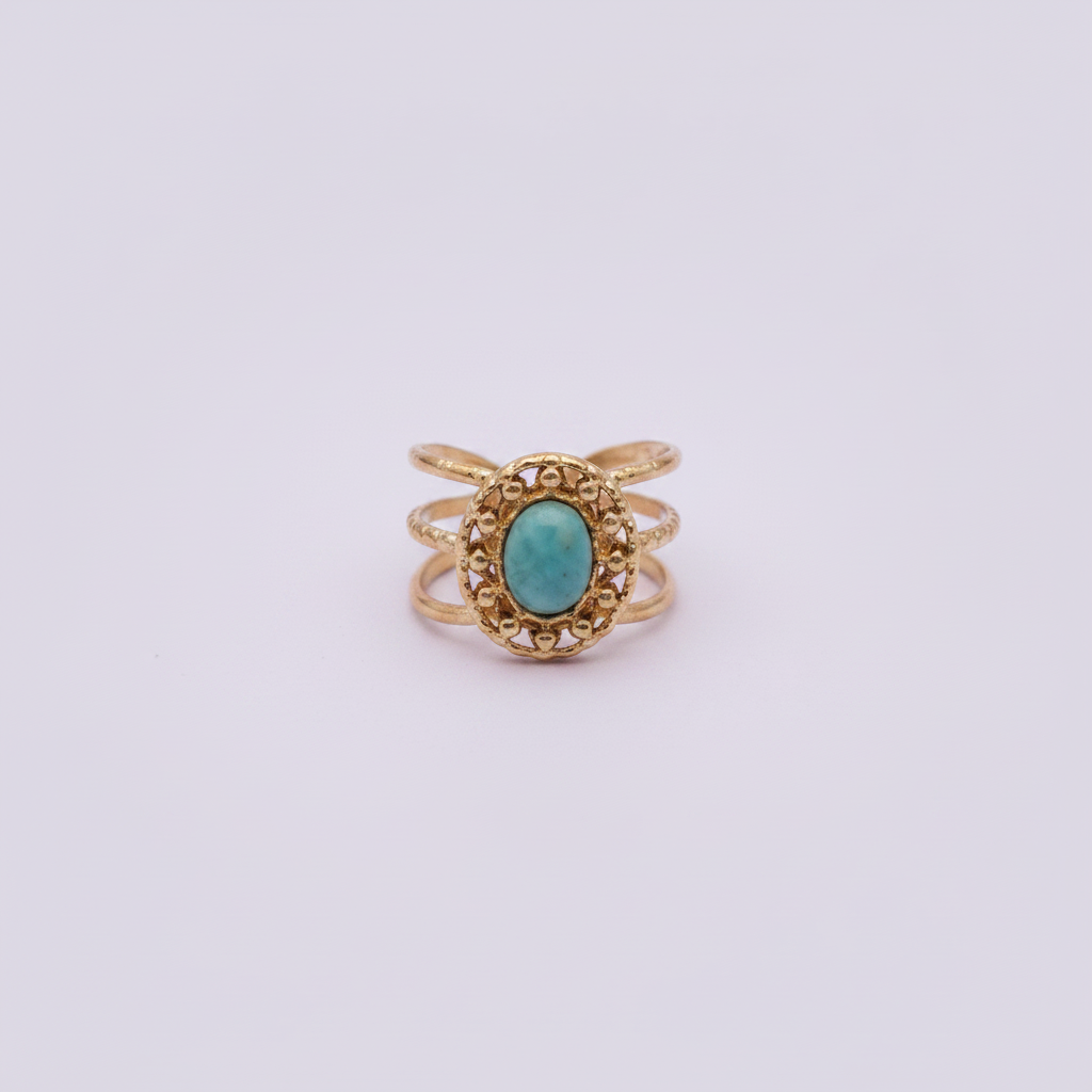Bague océan turquoise dorée fond lilas