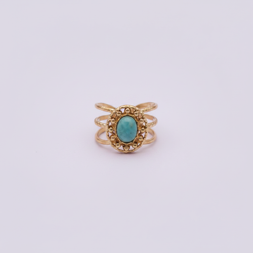 Bague océan turquoise dorée fond lilas